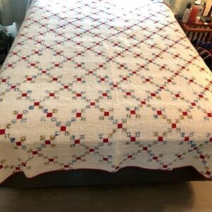 Queen sized antique quilt cream and red.
